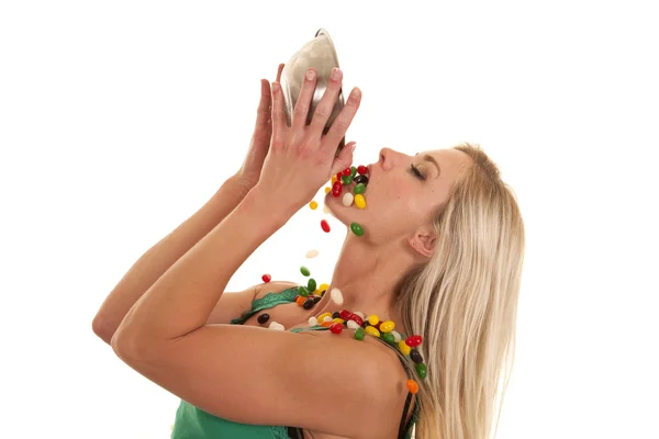 Woman dumping jelly beans into mouth — Stock Photo, Image