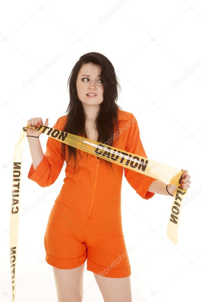 Woman orange prison caution look side