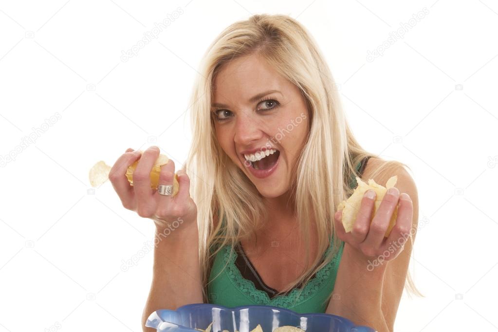 Woman handfuls of chips