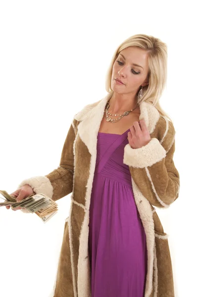 Woman holding money purple dress coat — Stock Photo, Image