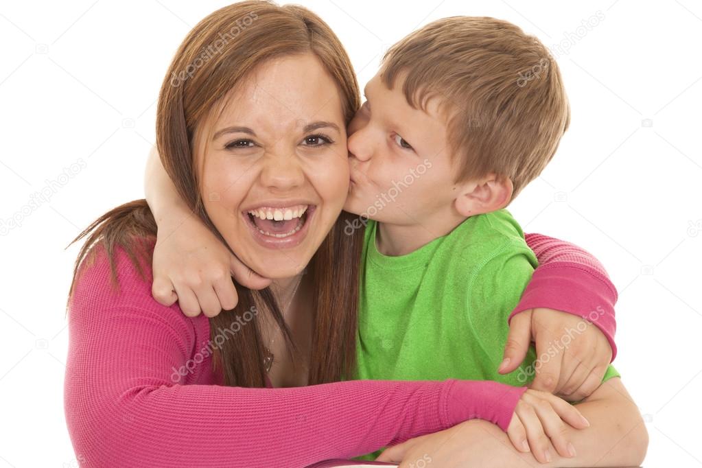 Girl and young boy kiss her laugh