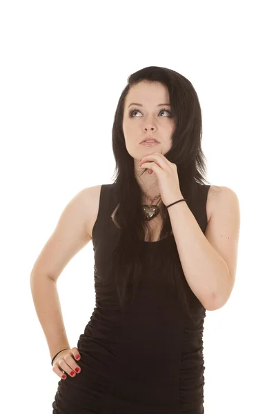 Woman black dress hand chin look up — Stock Photo, Image