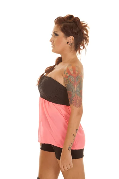 Woman tattoos pink shirt stand side — Stock Photo, Image