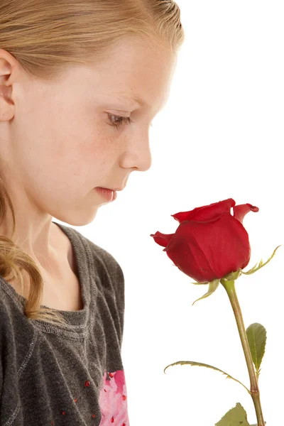 Girl look down at rose close — Stock Photo, Image