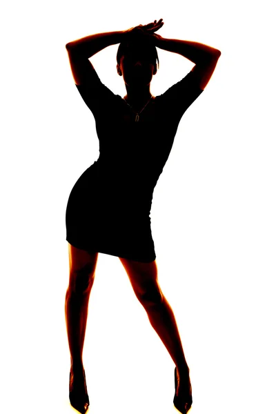 Silhouette of a woman with hands above head — Stock Photo, Image