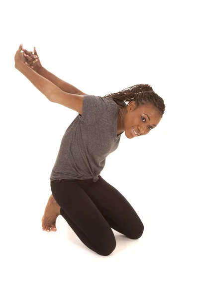 Woman in gray shirt fitness stretch arms back — Stock Photo, Image
