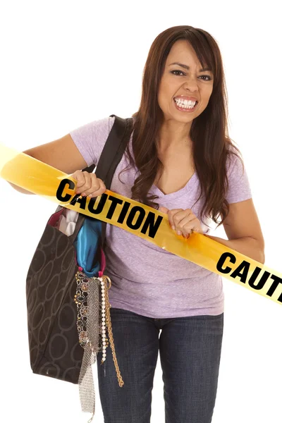 Woman shopper pull caution tape — Stock Photo, Image