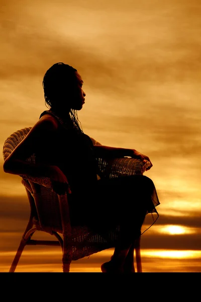 Woman sit sideways silhouette — Stock Photo, Image