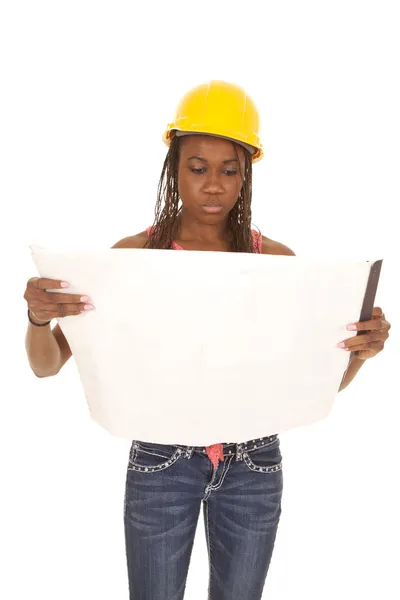 Woman with construction hat orange tank plans facing — Stock Photo, Image