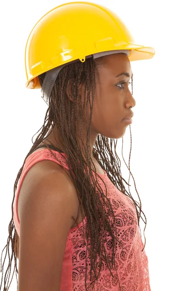 Vrouw met bouw hoed oranje tank kant — Stockfoto