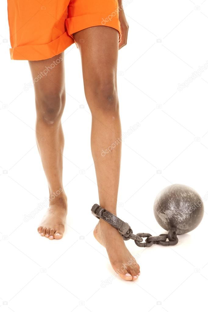 woman prisoner orange foot with chain