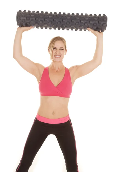 Woman fitness pink bra roll over head — Stock Photo, Image