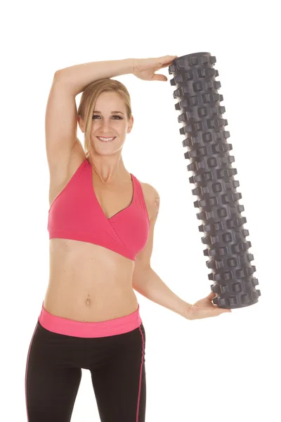 Vrouw fitness roze beha roll naar kant — Stockfoto