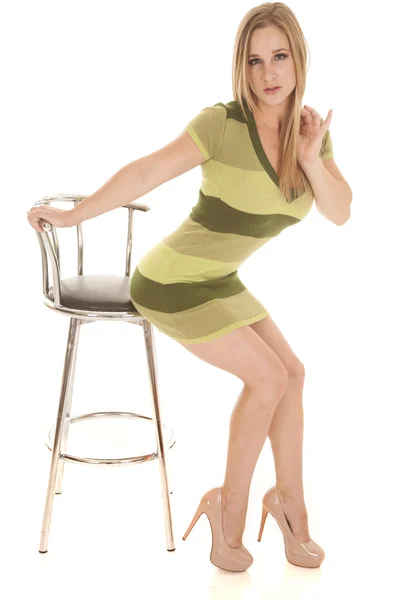 Woman green stripe dress sit barely on chair — Stock Photo, Image