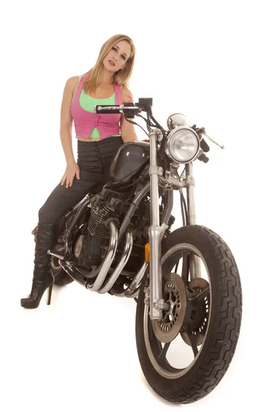 Woman pink green sit serious motorcycle — Stock Photo, Image