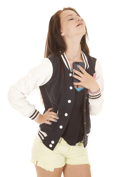 Girl holding onto her phone by chest — Stock Photo, Image