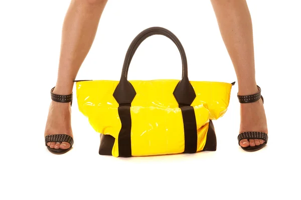 Woman legs yellow bag sit between — Stock Image Woman legs yellow bag sit between Stock Image