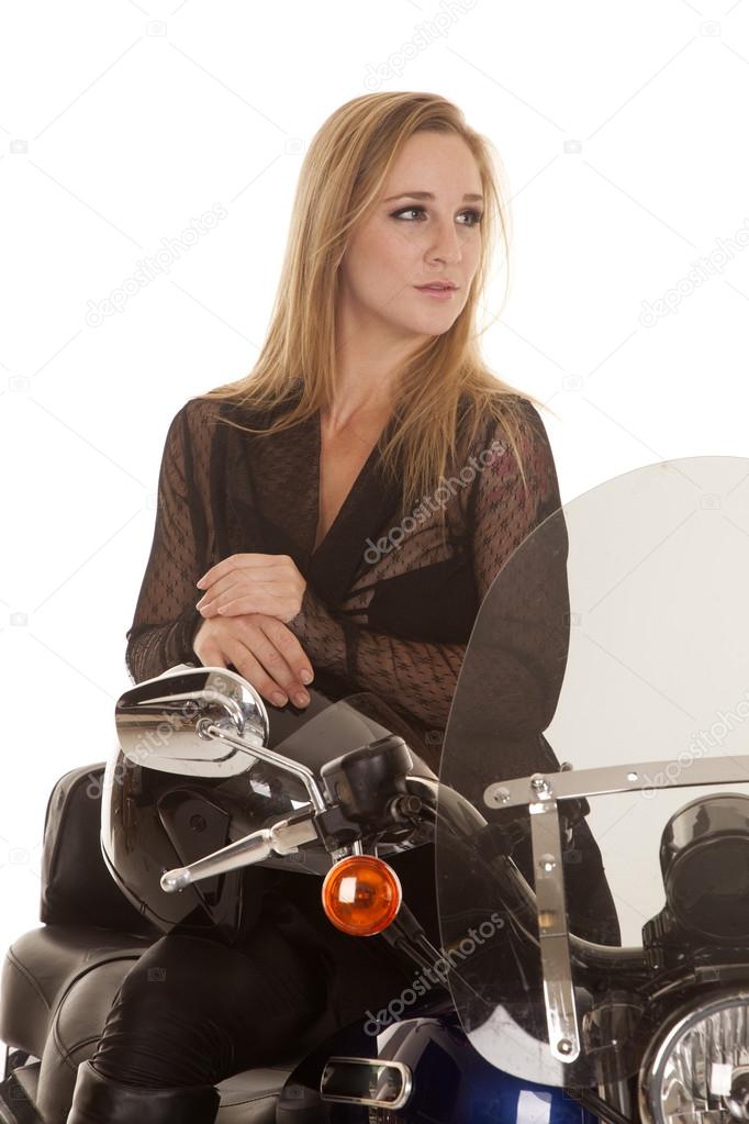 woman blond sit motorcycle clow look side