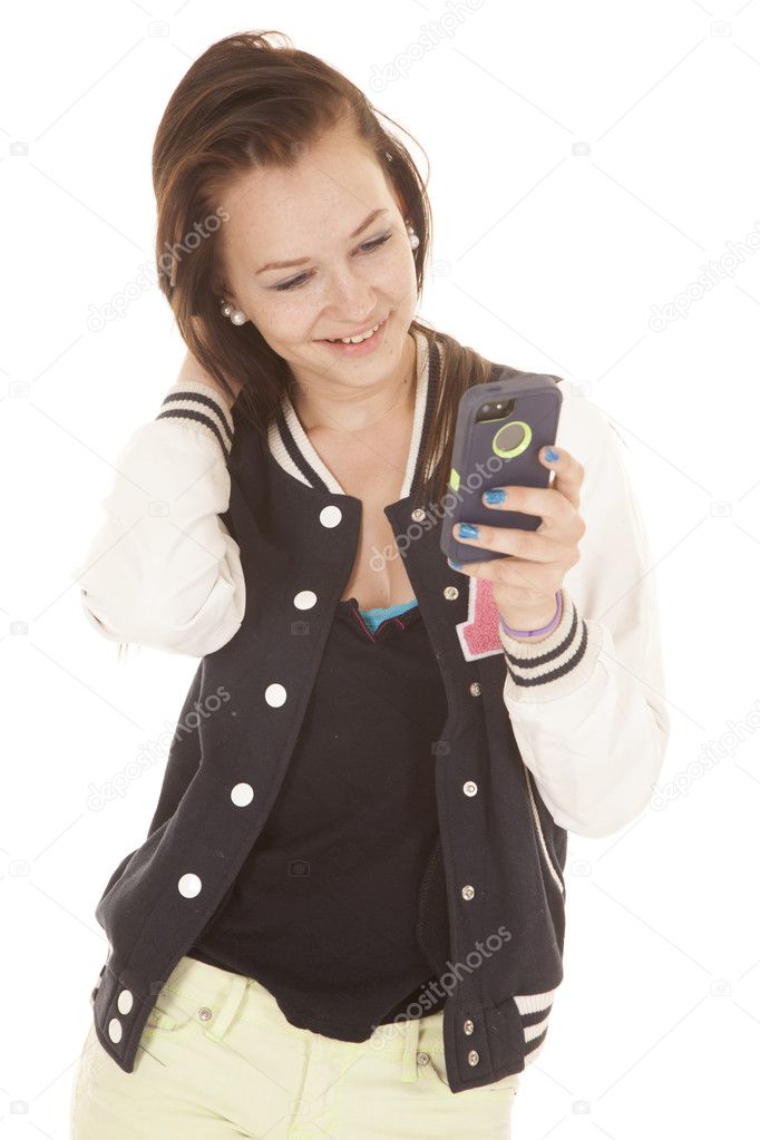 Teen smiling at cell phone