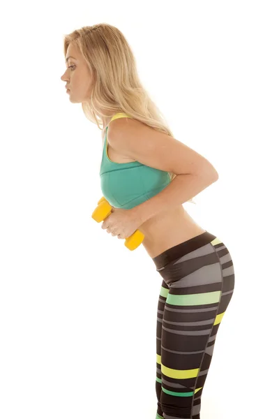 Sports bra stripe pants yellow weights bend forward side — Stock Photo, Image