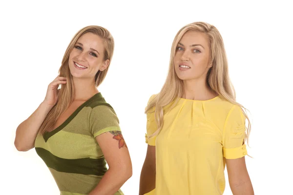 Two women green yellow stand smile — Stock Photo, Image