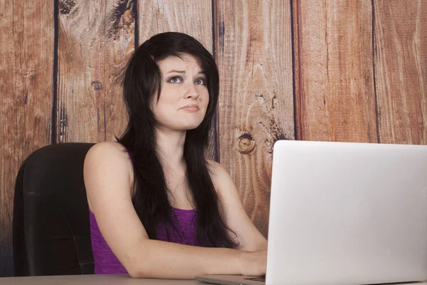 Woman sit in office nose ring computer unsure — Stock Photo, Image