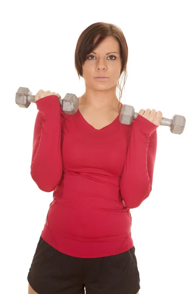 Woman pink sports shirt curl both — Stock Photo, Image