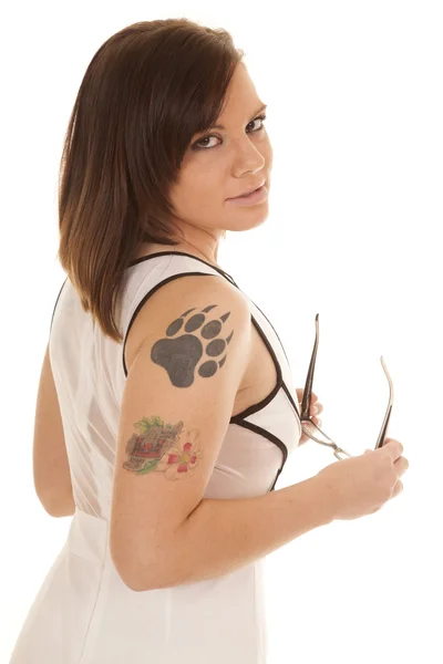 Woman white dress claw tattoo side glasses serious — Stock Photo, Image