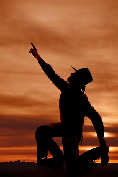 Cowboy knäböja silhuett punkt upp — Stockfoto