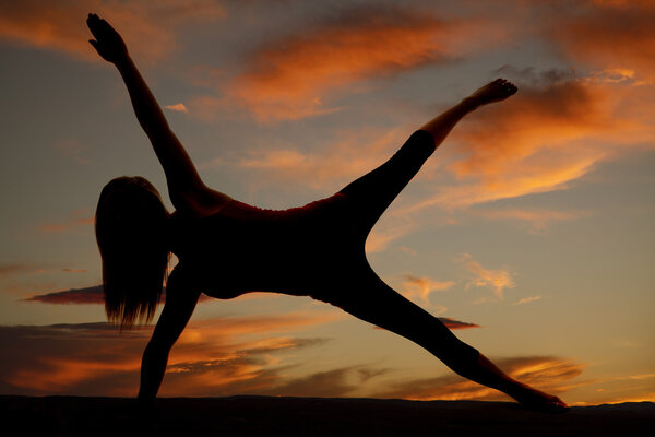 silhouette woma on one hand hand one foot