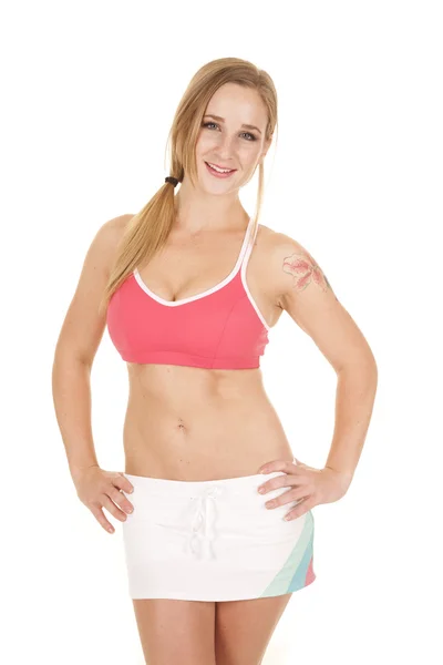 Woman pink bra skirt hands hips — Stock Photo, Image