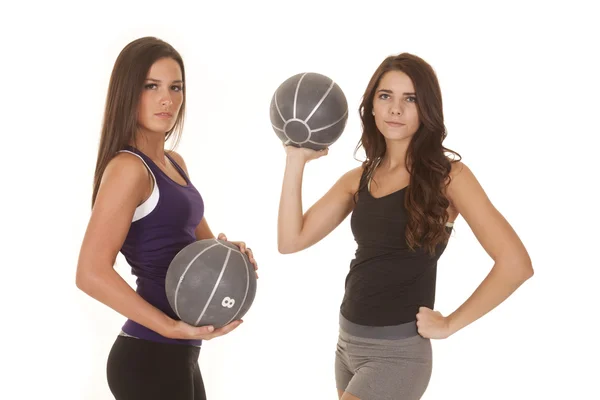 Two women fitness hold medicine balls serious — Stock Photo, Image