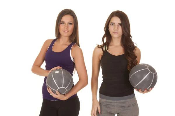 Two women fitness facing medicine balls — Stock Photo, Image