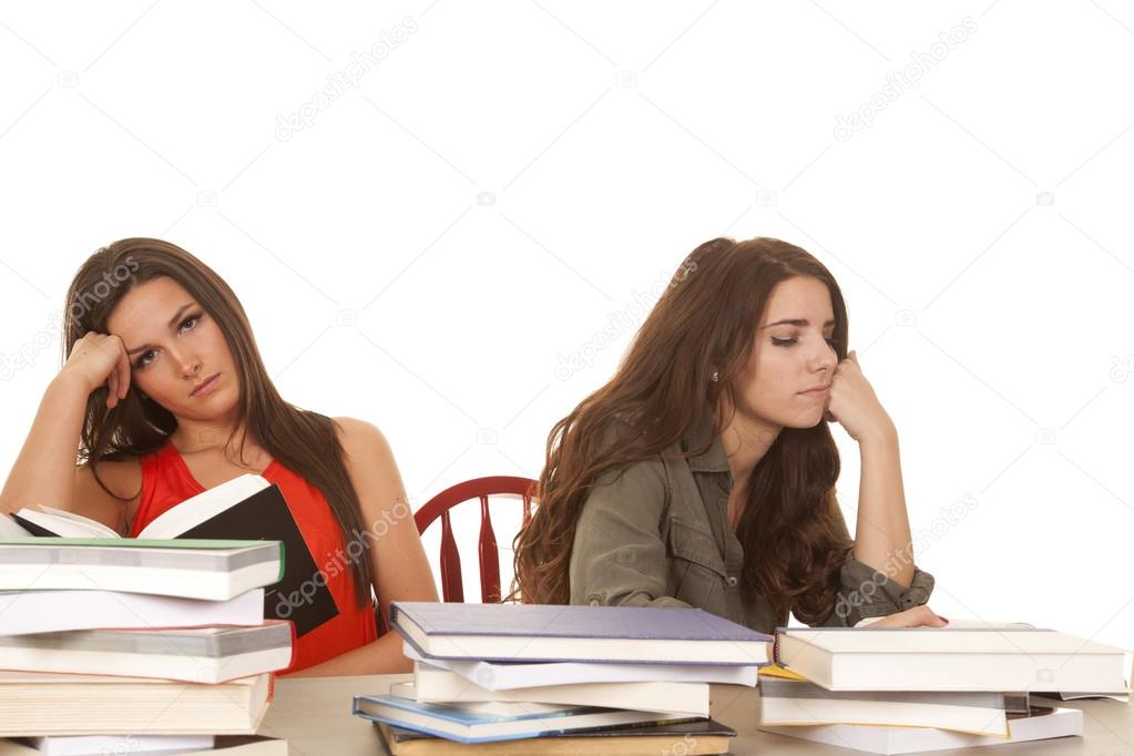 Two women with books are bored