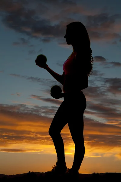 Silhouette woman side curl balls — Stock Photo, Image