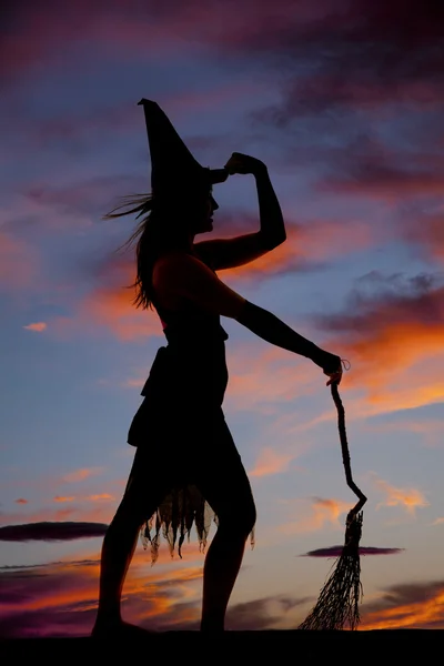 Silhouette woman witch broom hold hat — Stock Photo, Image