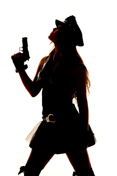 Sylwetka kobieta policjant pistolet blisko — Zdjęcie stockowe