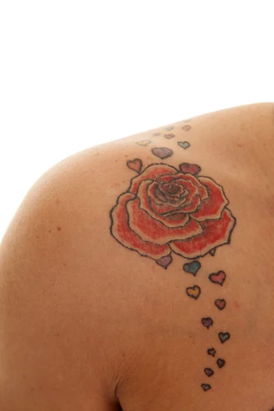 Kvindelige ben krydser tatovering lægge fødder op - Stock-foto