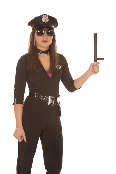 Vrouw cop met stick omhoog — Stockfoto