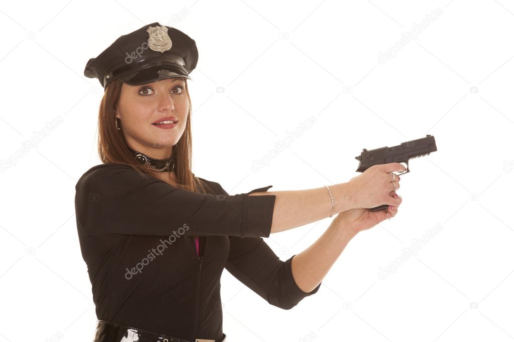 Woman cop point pistol to side