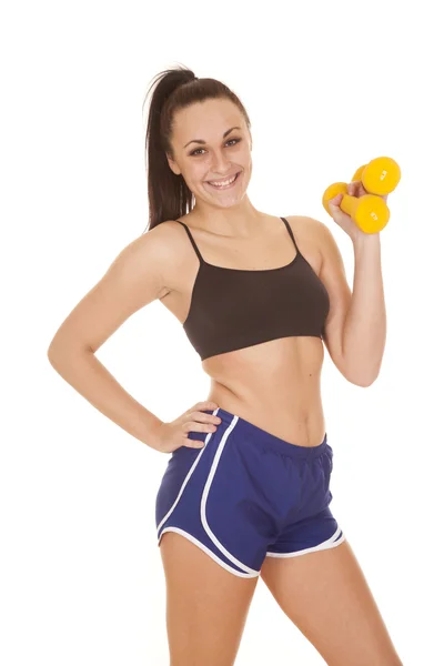 Woman blue shorts weights in on hand — Stock Photo, Image