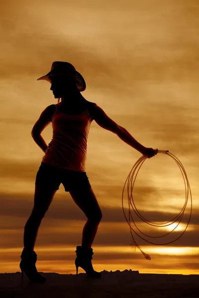 Silhouette woman cowgirl hat look back rope — Stock Photo, Image