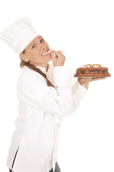 Woman baker cake taste — Stock Photo, Image