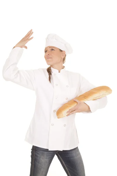 Woman chef bread hand up — Stock Photo, Image