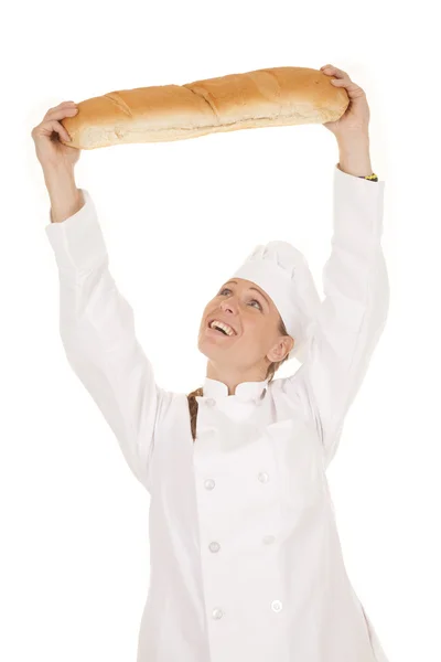 Mulher chef pão sobre cabeça — Fotografia de Stock