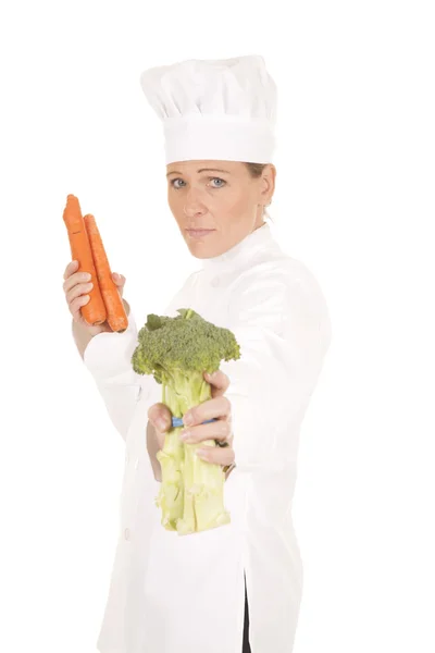 Woman chef vegetables hold out — Stock Photo, Image