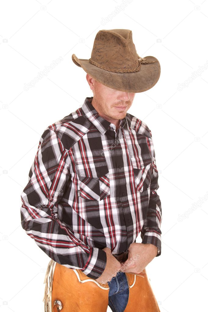 cowboy hat over eyes hands in belt