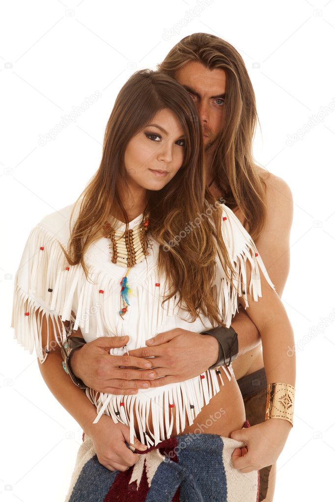 couple long hair man behind Native American woman looking