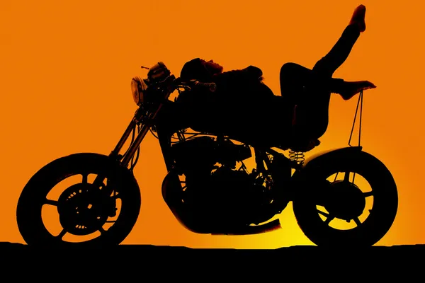 Silhouette woman on motorcycle lay back toes up — Stock Photo, Image