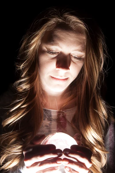 Woman crystal ball close light — Stock Photo, Image